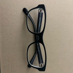 Black Michael Kors glasses.